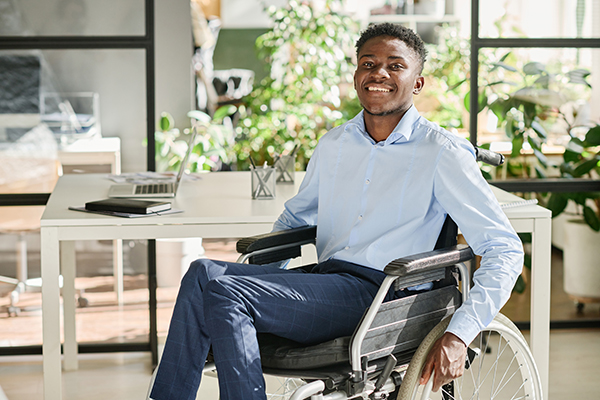 businessman-with-disability-working-office confident SSDI employee at work