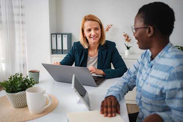 businesswomen-discussing-meeting-office Employment Network consultant with SSDI worker